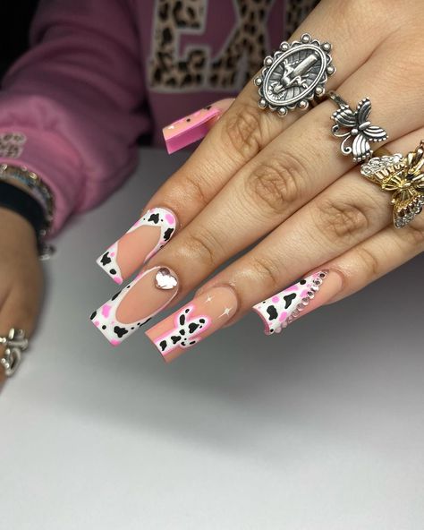 If you're a big fan of animal-inspired manicures, then pink cow print nails might be just what you need for your next nail design project! Includes beautiful pink nail polish designs for short nails, long nails, coffin nails, almond nails and many other options. Pink Vaquita Nails, Pink Cowgirl Nails Designs, Hot Pink Cow Print Nails, Cow Print French Tip Nails, Short Cow Print Nails, Pink Cow Nails, Pink Nail Polish Designs, Print French Tip Nails, Pink Cow Print Nails