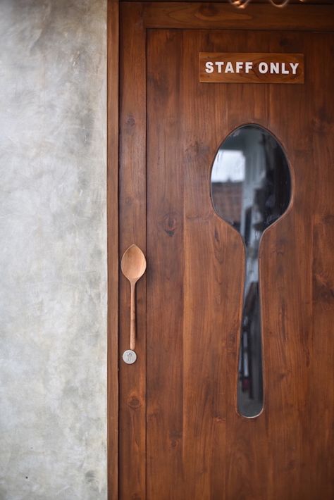 this cafe in bali, indonesia plays with spoon Kitchen Door Restaurant, Cafe Door Design, Diy Restaurant Decor, Restaurant Door Design, Resturant Ideas Design Interiors, Cafe Theme Ideas, Restaurant Kitchen Door, Restaurant Wall Design Ideas, Cafe Decoration Ideas