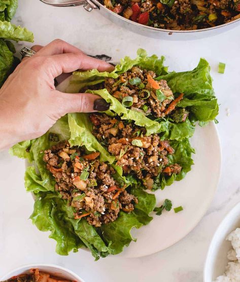 These quick-to-make ground beef lettuce wraps are loaded with savory ground beef and veggies doused in an umami-rich Asian-style soy ginger sauce! You can enjoy them with the beef filling nestled in crunchy lettuce as appetizers or snacks, or make them substantial enough for lunch or dinner by adding rice or grains. A fast ground beef dinner idea to add to you repertoire, the lettuce wraps come together in only 25 minutes, can be prepared ahead of time, and are easily made gluten free, too! Ground Beef Lettuce Wraps, Quick Pork Chop Recipes, Easy Lettuce Wraps, Soy Ginger Sauce, Lettuce Recipes, Asian Lettuce Wraps, Ground Beef Dinner, Beef Wraps, Beef Lettuce Wraps