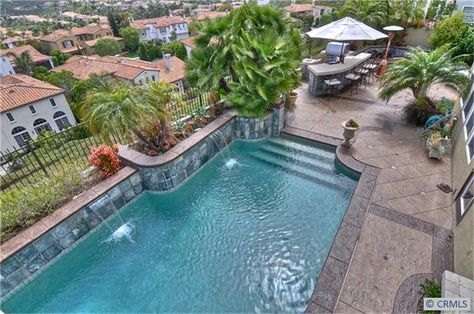 View from master balcony of the outdoor kitchen with sink, BBQ, built-in ice chest seating bar and beautiful views. Retaining Wall Pool, Outdoor Kitchen With Sink, Master Balcony, Pool Outdoor, Fire Pit Bowl, Ice Chest, San Juan Capistrano, Outdoor Bar, Retaining Wall