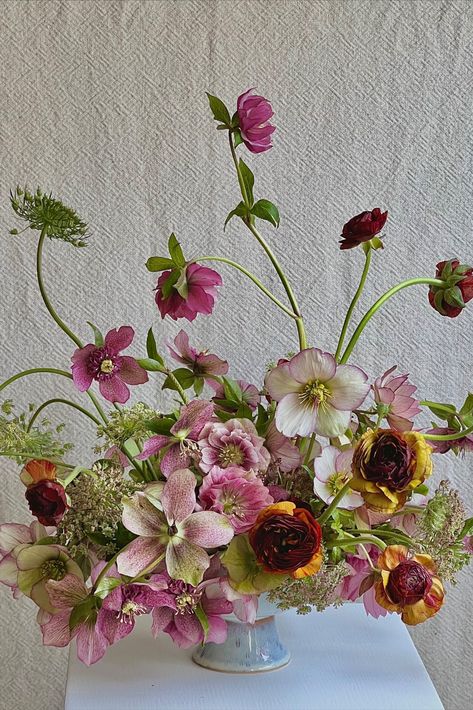 hellebores ranunculus floral centerpiece Seattle Washington wedding florist floral designer spring winter florals Artsy Flower Arrangements, Whimsical Flower Bouquet, Hellebore Arrangement, Hellebore Wedding, Hellebore Bouquet, Whimsical Flower Arrangements, Purple Floral Decor, Hellebore Flower, Spring Floral Design