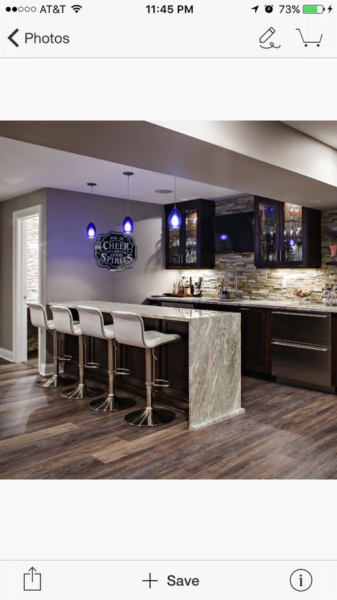 Finished wet bar with waterfall countertop and nice details Wet Bar With Island Basement, Waterfall Island Bar, Waterfall Bar, Wet Bar Island Ideas, Waterfall Bar Countertop, Wet Bar Ideas Basement, Basement Wet Bar Ideas, Modern Home Bar Designs, Wet Bar Basement