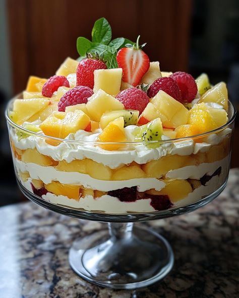 This Mixed Fruit Trifle is always a crowd-pleaser! It’s colorful, delicious, and super easy to make. The layers of fruit and cream create a refreshing treat. Perfect for parties or just because!  For three decades, I’ve been making this trifle! Everyone always asks for the recipe. One scoop, and you're in love! Link in first comment [👇] [👇]  Ingredients: - 2 cups mixed fresh fruits (like berries, bananas, and kiwi) - 1 cup whipped cream - 1 cup sponge cake pieces (or ladyfingers)  For the full recipe details, including additional ingredients, check the link in the first comment [👇] [👇]  #FruitTrifle #DessertLovers #ColorfulDelight #EasyRecipes #FoodieFun Fruit Cups For Party, Fruit And Cream, Fruit Trifle, Fruit Parfait, Mixed Fruit, Fresh Fruits, Recipe Details, Crowd Pleaser, Sponge Cake