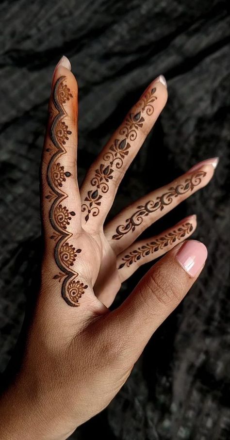 Henna designs, also known as Mehndi designs, are intricate and beautiful patterns typically applied to the skin using henna paste. These designs are often used for celebrations and special occasions, particularly in South Asia, the Middle East, and North Africa. The art of henna design has been practiced for centuries and varies greatly depending on cultural traditions and personal preferences. forget me not flower tattoo baddie arm tattoos kalogeras sisters dainty tattoos small Henna Inspired Tattoos, Tato Henna, Finger Henna Designs, Henna Tattoo Designs Hand, Finger Henna, Mehndi Designs Bridal Hands, Latest Henna Designs, Simple Mehndi Designs Fingers, Very Simple Mehndi Designs