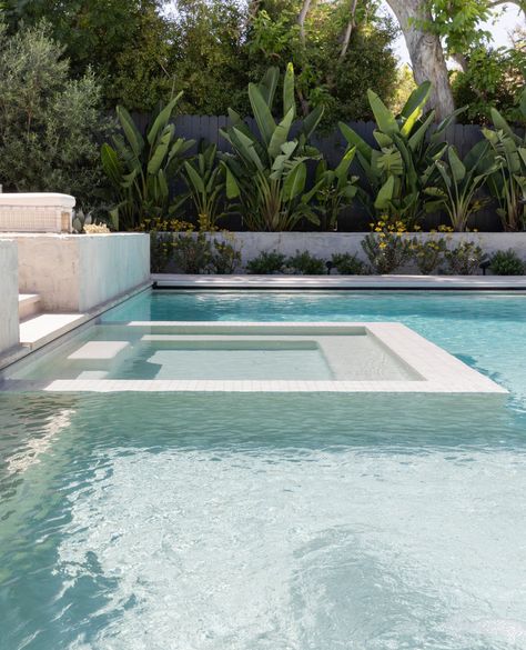 The stunning salt water pool at our #gsdxsantiagoparadise project features a modern infinity edge plunge spa, visually merging the two boundaries into one. Languid afternoons spent pool-side are just within reach, and boy does this scene have us feelin' ready to dive in!👙⁠ ⁠ _________________________⁠ ⁠ Project: #gsdxsantiagoparadise  ⁠ Landsape Build: @dig_landscapeconstruction⁠ Interior: @prairie_interiors ⁠ Photo: @rileystarrphoto Modern Pool With Hot Tub, White Waterline Tile Pool, Infinity Pool Design Ideas, Rectangular Pool Landscaping, Pool Color Ideas, All White Pool, Pool Water Feature Wall, Modern Pool Ideas, Alamo Project