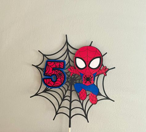 Handmade Personalised with any number Spider-Man Spidey cake topper. This Cake topper is made from Strong good quality card and coloured vinyl. Finished with a Food safe stick to hold the topper onto the cake. This Cake topper is approximately 18cm in size ( Round) Customer requests are always welcome... if you would like small changes or you would like something different please feel free to send a message. Please leave your personalisation requests in the message seller box at checkout, Or ple Diy Spiderman Decorations, Spidey Cake Topper, Spiderman Birthday Party Food, Spidey Cake, Spidey Birthday, Cake Topper Number, Spiderman Birthday Party Decorations, Spiderman Decorations, Spiderman Cake Topper