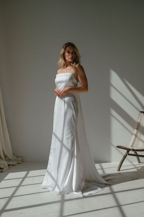 A modern take on a period style. Our High Tide gown is a strapless gown with a thigh high leg split, and features a Watteau train that detaches, giving you two looks in one. Made in a crepe back satin, this gown has the perfect sheen and weight. Watteau Train, High Tide, Strapless Gown, High Leg, Boho Bride, Thigh Highs, High Fashion, Satin, Wedding Dresses