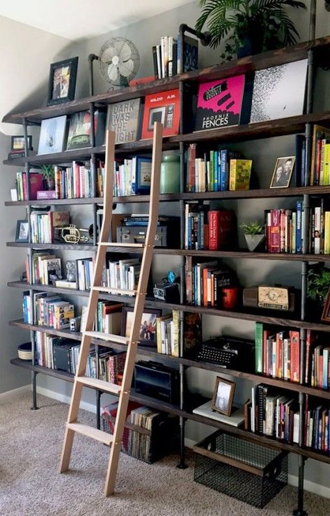 DIY Industrial Shelves on a #Budget   Think outside the box when it comes to updating spaces in your home that sit empty or get little attention. These large floor-to-ceiling #industrial shelves provide great storage as well as decor. Industrial Shelf Diy, Industrial Shelves, Floor To Ceiling Bookshelves, Ceiling Shelves, Diy Ladder, Industrial Shelving, Bookshelves Diy, Home Libraries, Study Rooms