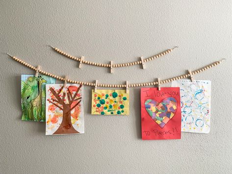 This garland is neutral and very versatile. It’s perfect if you’re a classroom teacher and want to display student’s work or educational sheets you’ve created for display. Same goes for homeschooling families! When the holidays come around, this works well as a boho Christmas/holiday card display! Hanging Student Work, Playroom Loft, Holiday Card Display, Art Display Ideas, Kids Art Display, Art Craft Room, Art Display Kids, Decor Classroom, Wood Clothes