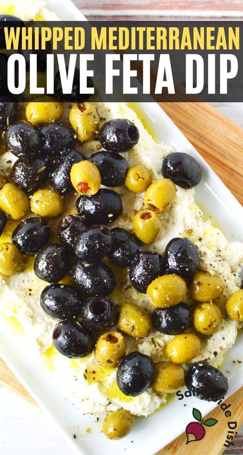 This Mediterranean Feta dip with whipped feta and roasted olives is one of the best Greek dips ever. Marinated black and green olives in olive oil and seasonings are oven roasted and then poured onto a creamy delicious and perfectly herbed feta dip. This dip is a pull from typical appetizer dips and has a feel of a fancy restaurant all while being incredibly easy to make. Creamy and indulgent, whipped feta dip is perfect for dense crackers or bread and makes a crazy good spread. Roasted Olives With Whipped Feta, Appetizer Using Feta Cheese, Whipped Feta And Olive Dip, Olives And Feta Cheese, Whipped Feta Dip With Olives, Whipped Feta And Roasted Olives, Olive Feta Dip, Feta Dip With Olives, Feta And Olive Dip