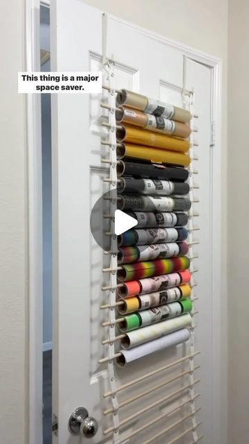 Megan Meketa • Crafting Tutorials on Instagram: "Let’s chat vinyl storage!! 📦💕 This is the craft room vinyl organizer from my friend Renee, @crafterscreek!! It can hold 25 rolls of vinyl and transfer tape and can be hung on the back of a door or on a wall. Major space saver!! It’s the perfect way for me to store my @teckwrapcraft vinyl rolls and transfer tape!! 👌✨ #craftstagram #happycrafting #ilovecrafting #lovecrafting #lovetocraft #craftlover #craftsupplies #craftingcommunity #craftstorage #craftingtools #crafttools #vinylstorage #craftroomorganization #smallcraftbusiness #craftroomstorage #cricut #heattransfervinyl #htvvinyl #teckwrapcraft" Storage For Cricut Vinyl, Ways To Store Cricut Vinyl, Vinyl Rolls Storage Ideas, Storage For Vinyl Rolls Diy, How To Organize Vinyl Rolls, Diy Vinyl Roll Holder, Ways To Store Vinyl Rolls, Circuit Vinyl Storage, Storing Cricut Vinyl Rolls