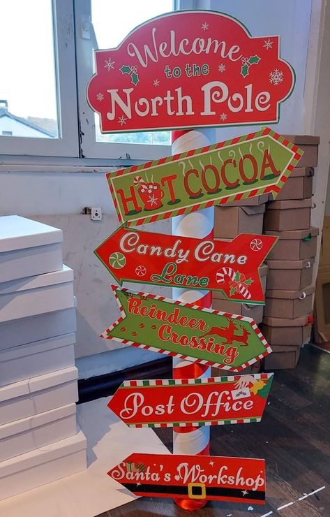 Christmas Grotto Decorations, Christmas Directional Signs Diy, Christmas Poles Diy, Santas Work Shop Decoration, Christmas Decor Signs Diy, Diy North Pole Decoration, Diy Santa Grotto, Homemade Christmas Decorations Outdoor, North Pole Sign Diy