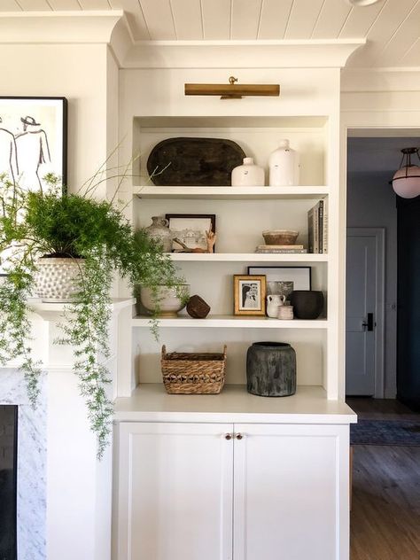 Bookshelves With Picture Frames, Bookshelves With Sconces, Above Bookshelf Lighting, Lights In Bookcase, Styling Bookshelves Living Room, White Built In Bookshelves, Hallway Bookshelves, Built In Cabinets Living Room, Styling Bookcases