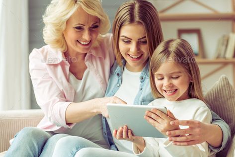 Granny, mom and daughter by GeorgeRudy. Granny, her daughter and granddaughter are using a tablet and smiling while sitting on sofa at home #Sponsored #GeorgeRudy, #granddaughter, #daughter, #Granny Mother Daughter Granddaughter, Attack On Titan Eren, Photo Composition, Mom And Daughter, Creative Photos, Grandchildren, Mother Daughter, Dream Life, At Home