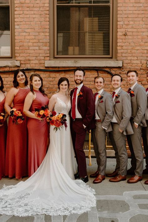 The most important thing about your wedding attire is that you're comfortable... Confidence and comfort show in your photos! You won't be tugging at your attire all day, and you'll exude confidence because you know you look good. Red And Orange Wedding Groomsmen, Burnt Orange Bridesmaid Dresses With Groomsmen, Fall Wedding Bridal Party Groomsmen, Maroon Suit Wedding Party, Burgundy Bridal Party Groomsmen, Maroon And Brown Wedding, Burgundy Groomsmen Attire Fall Wedding, Burgundy And Tan Wedding Party, Orange Maroon Wedding