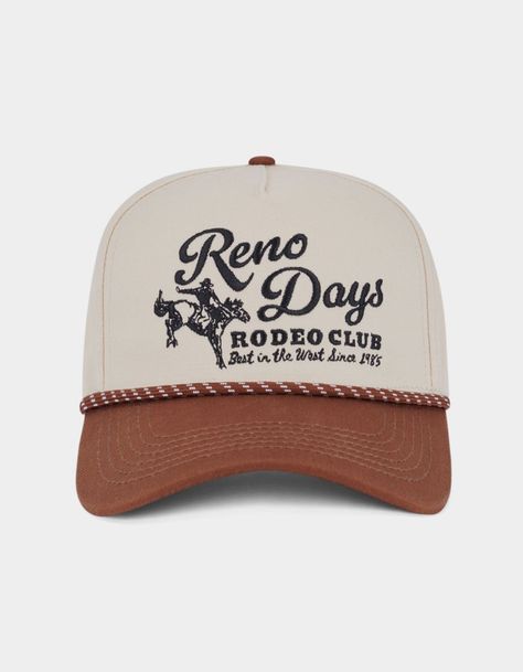 Reno Days Snapback Hat. 5-Panel Structured Hat. Embroidery On Front. Braided Rope Across Curved Visor. Adjustable Snap Closure. 100% Cotton. Imported. Vintage Western Hats, Vintage Snapback Hats, Classic Baseball Cap, Embroidered Trucker Hats, Men’s Hat, Embroidered Trucker Hat, Trendy Trucker Hat Snapback For Rodeo, Lane Frost Hat, Retro Snapback Hats For Country Events