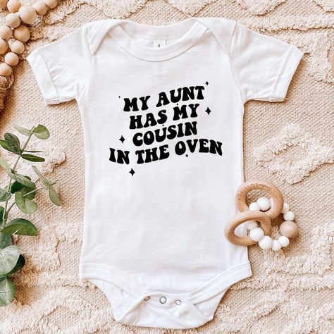 My Aunt Has My Cousin In The Oven Bodysuit, Aunt Gift, Funny Baby Onesie®, Pregnancy Gift, Baby Announcement, Coming Home Outfit Welcome to SareKidsStyle! HOW TO ORDER * Please review all the information provided before placing an order. 1. Select the style and size using the drop-down menu. 2. Select color 3. [APPLICABLE ONLY ON CERTAIN LISTINGS] Follow the instructions to fill out the "Add your personalization" option, e.g., specifying custom sayings or selecting design colors. 4. Select quant Aunt Onesie Announcement, Cousin Onesie, Auntie Pregnancy Announcement, Aunt Baby Onesie, Cool Aunt Onesie, Nephew Onesie Aunt, Take Me To My Aunt Onesie, Aunt Onesie, Funny Baby Onesies