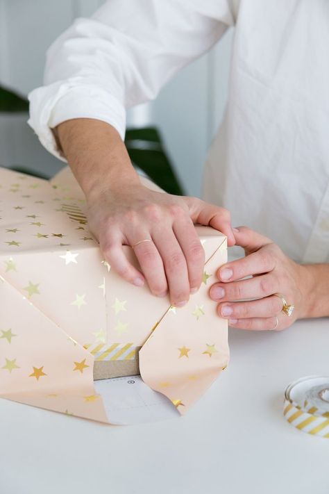 A step-by-step guide to wrapping the perfect present How To Wrap A Gift Step By Step, How To Wrap A Present Step By Step, Stacked Gift Wrapping, Gift Wrapping Step By Step, Wrapping A Present, How To Wrap A Box Gift, Present Wrapping Tutorial, How To Wrap A Present, How To Wrap A Gift