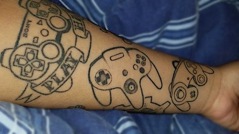 My controller tattoos. #kittykurbstomp @kittykurbstomp #tattoos #nintendo #sony #n64 N64 Controller Tattoo, N64 Tattoo, Controller Tattoo, Playstation One, Button Tattoo, Forearm Tattoo, Tattoo Inspo, Treasure Chest, Playstation