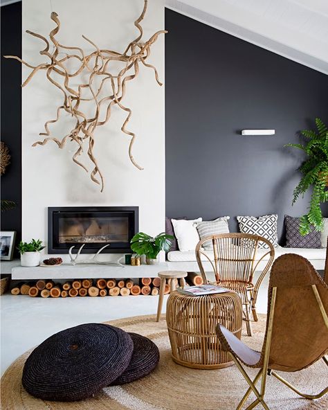 This living room commands attention with it's high-raked ceilings and a dark feature wall. And we love the pairing of timber and… Fireplace Feature Wall, Raked Ceiling, Feature Wall Living Room, High Ceiling Living Room, Tropical Home Decor, Small Apartment Decorating, Home Fireplace, Home Design Living Room, Fireplace Design