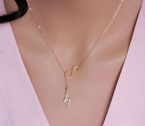 Excited to share this item from my #etsy shop: Music note necklace Gold - Infinity Music necklace lariat Neckalce - Music Teacher Gift - Graduation Gift - Musician Gift - Music Gift Infinity Music, Chrysocolla Jewelry, Music Note Necklace, Music Necklace, Music Teacher Gift, Music Teacher Gifts, Symbol Necklace, Graduation Gifts For Her, Gift Graduation