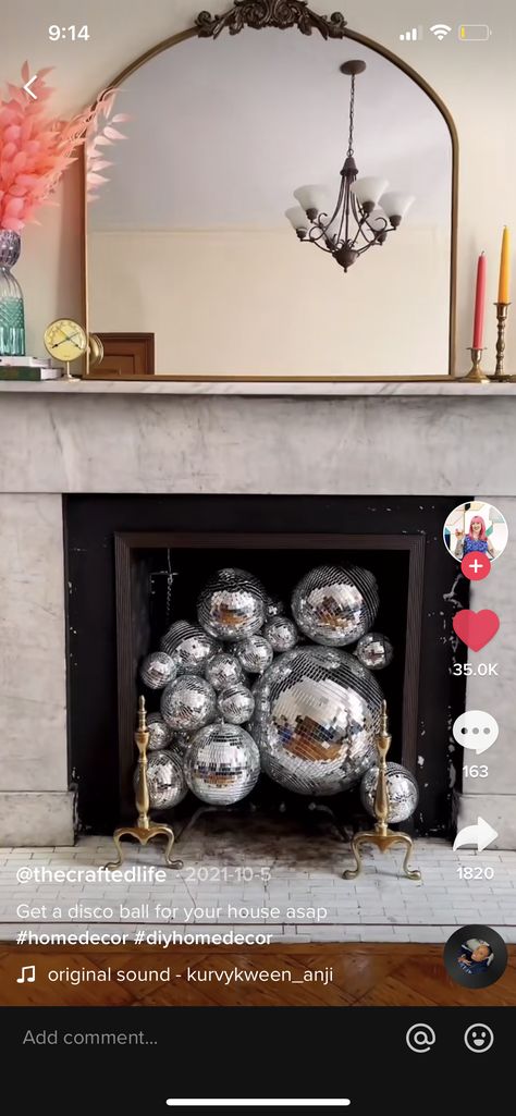 Disco Fireplace, Disco Balls In Fireplace, Disco Ball Decor Christmas, Disco Ball Fireplace, Disco Ball And Candles, Fireplace Disco Ball, Disco Ball Holiday Decor, Fake Fireplace, Candles In Fireplace