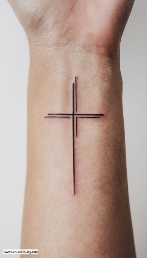 Minimalist Cross Wrist Tattoo Cross Faith Tattoos For Women, Cross Heart Tattoos For Women, Cross With Names Tattoo Design, Christian Vine Tattoos For Women, Simple Tatoos Woman, Cross With Bible Verse Tattoo, Wrist Cross Tattoos For Women, Pretty Cross Tattoos For Women, Ichthus Tattoo