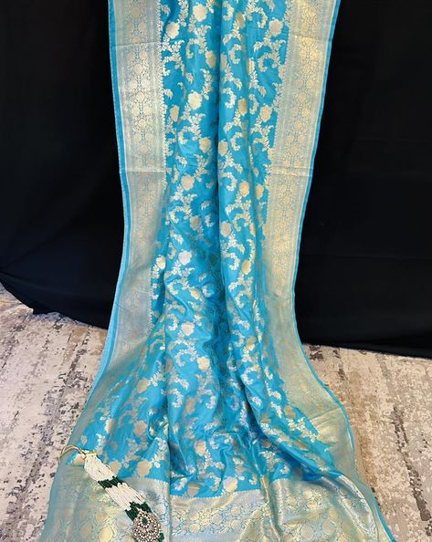 Embrace ethereal elegance with our Sky Blue Katan Silk Saree adorned with lustrous gold zari. Crafted with the finest Katan silk, this saree exudes a subtle charm that is both modern and timeless. The sky blue hue is a refreshing departure from traditional shades, offering a contemporary twist to the classic Banarasi aesthetic. Shop now: https://thechictale.com/products/banarasi-pure-mulberry-katan-silk-saree-with-gold-zari-blue #handwoven #thechictale #loveforsaree #thechictale🥻 #banarsi... Ethereal Elegance, Banarsi Saree, Katan Silk Saree, Aesthetic Shop, Saree Trends, Katan Silk, Saree Styles, Blue Hues, The Chic