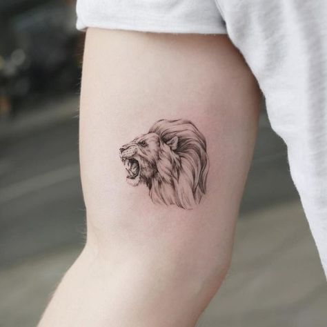 Lion tattoos are one of the most popular tattoos for men’s, being a symbol of strength, power, authority, courage and confidence, for thousands of years. “The King of the Jungle” it’s one of the most recognizable images in the world and has been used in tattoos for a wide variety of reasons. Simple Lion Tattoo, Lion Tattoo Ideas, Lion Shoulder Tattoo, Small Lion Tattoo, Mens Lion Tattoo, Lion Head Tattoos, Lion Tattoo Design, Warrior Tattoo, Cool Small Tattoos