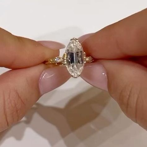 EAST WEST GEM CO. // on Instagram: "An old mine moval cut in our Harlow Setting is never not stunning, specifically with this combo of upgrades that this client added! This includes a donut, invisible halo, pavé bridge and marquise accent side stones. -————————— #EASTWESTHARLOW - 4.85 carats (1.89 ratio) - 13.75x6.25mm old mine moval, vintage white moissanite center set in a 14k yellow gold setting - $3,775 (as shown) 💵 Or as low as $131.53 a month with Bread Pay* 🤚🏻 Shown on a size 4.5 finger" Old Mine Cut Moval Engagement Ring, Old Mine Moval Cut, Old Mine Moval Engagement Ring, Marquise Oval Engagement Ring, East West Gem Co, Old Mine Cut Engagement Ring, Moval Engagement Ring, Diamon Ring, Delicate Fine Jewelry