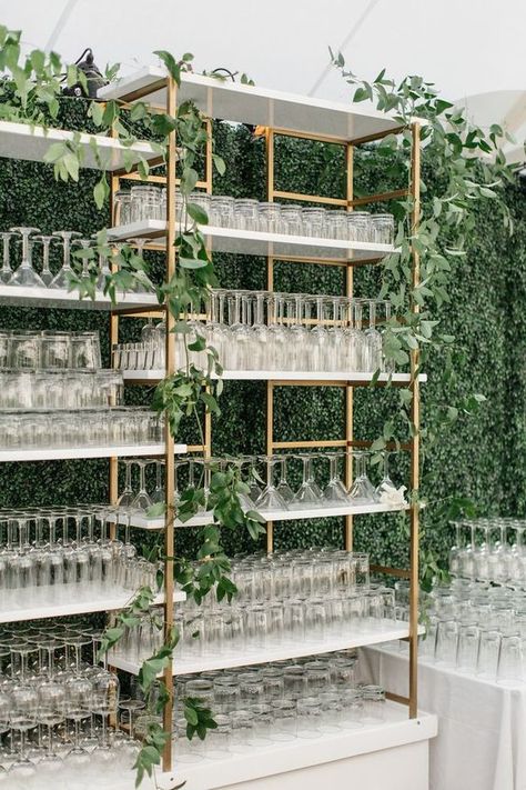 Love this beautiful gold glassware shelf covered in greenery for the perfect wedding bar design. Wedding Bars, Gold Wedding Reception, Glasses Storage, Wedding In California, Event Bar, White Shelves, Wedding Costs, Wedding Drink, Mobile Bar