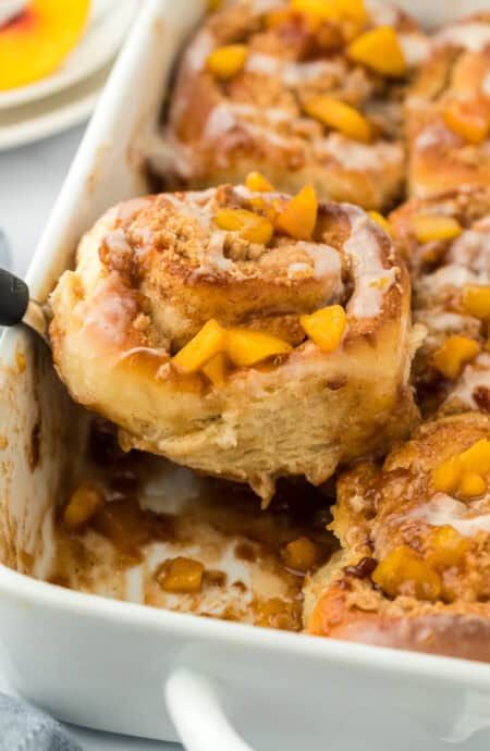 Gooey and Soft Peach Cobbler Cinnamon Rolls - Grandbaby Cakes Peach Cinnamon Rolls, Grand Baby Cakes, Peach Cobbler Cinnamon Rolls, Fluffiest Cinnamon Rolls, Peach Filling, Peach Cobbler Dump Cake, Grandbaby Cakes, Yeast Starter, Bread Yeast