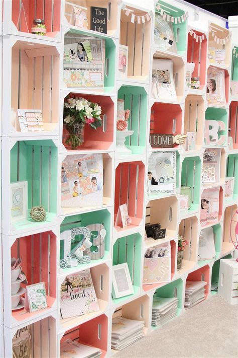 An all-over color change on a row of storage crates might be too much, but painting only the insides makes a lovely statement that doesn't feel childish. We love the pastel palette this blogger used in her trade show booth. See more at Chickaniddy »   - GoodHousekeeping.com Painted Crates, معرض فني, Dream Craft Room, Craft Fair Displays, Craft Show Displays, Craft Booth, Craft Room Storage, Crate Storage, Craft Show Ideas