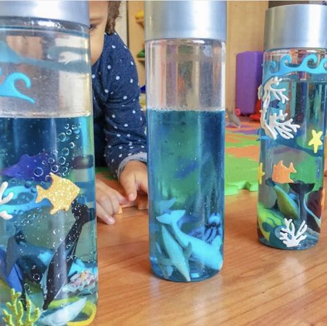 Sensory Bottles With Oil, Rainbow Sensory Bottles, Sensory Bottles Preschool, Voss Water Bottle, Aquarium Mini, Galaxy In A Bottle, Calming Jar, Voss Water, Calm Down Jar