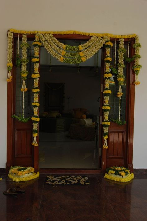 Beautiful entrance with combination of yellow,whites and greens. #zzeeh#zubair#wedding#designer#brides#grooms#weddinggoals#wedmegood#shaadisaga#theweddingbrigade#events#entrances#brideentry#groomentry#blrevents#bestinthecity Door Flower Decoration, Unique Wedding Ceremony Ideas, Ganapati Decoration, Housewarming Decorations, Mandap Decor, Marriage Decoration, Beautiful Wedding Decorations, Wedding Mandap, Wedding Entrance