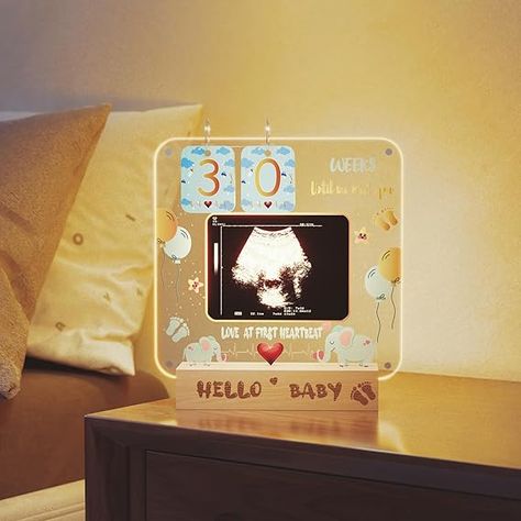 This Ultrasound Picture Frame is such a sweet keepsake! 🍼💖 It has a magnetic acrylic frame with a countdown calendar and light, perfect for displaying sonogram pictures. Ideal for baby shower decorations and the best gift for expecting moms! #MomToBe #BabyShower #Keepsake #BabyLove 🐘✨ Sonogram Picture Frame, Ultrasound Picture Frame, Baby Countdown, Sonogram Pictures, Elephant Baby Shower Decorations, Ultrasound Pictures, Expecting Mom Gifts, Gifts Mom, Acrylic Frame