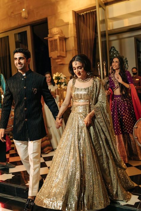 Presenting you latest Indian Sangeet Night Outfit ideas for Bride & Groom. From bridal gowns to bridal indo western outfits, we have got variety of sangeet outfits. #shaadisaga #indianwedding #sangeetoutfit #sangeetoutfitbridal #sangeetoutfitformen #sangeetoutfitbridalindowestern #sangeetoutfitbridalgown #sangeetoutfitforbride #sangeetoutfitideas #sangeetoutfitbridalunique #sangeetoutfitpunjabi #sangeetlehenga #sangeetlehengaforbride #sangeetlehengabridal #sangeetlehengadesigner #sangeetgown Indian Engagement Outfit, Indian Reception Outfit, Lehenga For Engagement, Engagement Dress For Groom, Wedding Matching Outfits, Udaipur Wedding, Engagement Dress For Bride, Engagement Lehenga, Reception Outfits