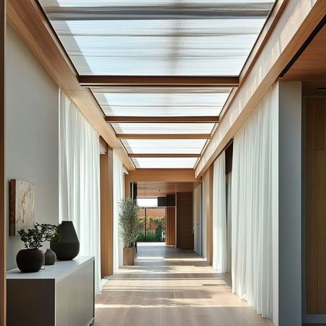 This beautiful corridor features a polycarbonate skylight, bringing natural light into the space while maintaining privacy. Polycarbonate is an ideal building material for skylights due to its lightweight durability, UV protection, and excellent light diffusion. Perfect for enhancing interiors with soft, ambient lighting, this skylight design creates a warm, inviting atmosphere that complements both modern and minimalist home or office aesthetics. Interior Skylight, Polycarbonate Skylight, Modern Skylights, Building Materials Architecture, Dream Ranch, Skylight Design, Building And Construction, Sky Light, Ceiling Detail