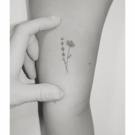 Small Daisy Rib Tattoo, Daisy And Lavender Bouquet Tattoo, Minimalist Daisy Tattoo Simple, Small Daisy Tattoo Color, Simply Daisy Tattoo, Daisy Initial Tattoo, Lavender And Flower Tattoo, Feminine Daisy Tattoos, Dainty Daisy Tattoo Wild Flowers