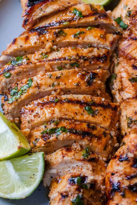 An EASY recipe for grilled Cilantro Lime Chicken, with a 5-minute prep time. The cilantro lime chicken marinade makes juicy, tender chicken. Cilantro Marinade Chicken, Sides For Cilantro Lime Chicken, Cilantro Lime Marinade Chicken, Cilantro Chicken Recipes, Chicken Cilantro Recipes, Fiesta Lime Chicken Recipe, Key Lime Chicken, Grilled Cilantro Lime Chicken, Lime Chicken Marinade