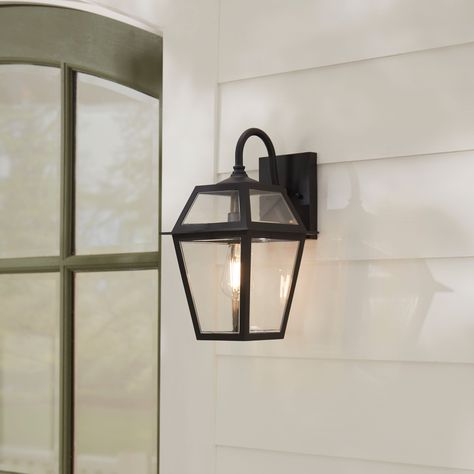 Transform your home's exterior with this stunning outdoor wall light that offers a stylish traditional design. Built to last with high-quality, non-corrosive, weather-resistant materials, this piece is perfect for illuminating any space. allen + roth Belasco 1-Light 15-in H Black Led, Outdoor Wall Light | WLM143BK Outside Farmhouse Lights, Exterior Home Lights, Outdoor Light Fixtures Garages, Porch Lights Ideas, Covered Porch Lighting, Flood Lights On House Outdoor, Front Door Lighting Exterior, Outdoor Garage Lighting, Exterior Garage Lights