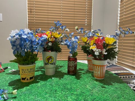 Picture of Texas wildflowers like blue bonnets, in Dr Pepper, Whataburger, Blue Bell and Buccee’s brand containers Texas Centerpieces, Texas Table Decorations, Texas Party Decorations, Texas Themed Party, Texas Themed Gifts, Welcome Back Party, Texas Party, Blue Bell Ice Cream, Texas Theme