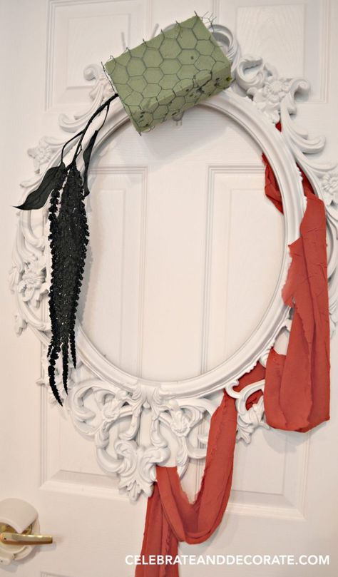 making-a-halloween-wreath-on-a-picture-frame Make A Halloween Wreath, Rustic Jewelry Organizer, Dry Floral Foam, Picture Frame Wreath, Spooky Diy, Book Page Wreath, Green Front Doors, Diy Halloween Wreath, Elegant Halloween