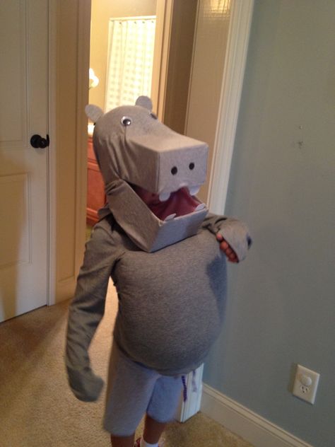 Homemade Hippo costume- no sewing required!  Just use 2 shoe boxes an old gray shirt and facial accents (googly eyes, stiff felt for teeth and ears); then use oversized gray shirt and shorts with a pillow stuffed for the body. Took some creativity and a hot glue gun to make it work but it turned out great! Diy Hippo Costume, Diy Hungry Hippo Costume, Homemade Elephant Costume, Hippo Costume Diy, Hippopotamus Costume, Fantasia Hippo Ballerinas, Hippo Mask, Hippo Costume, Book Costumes