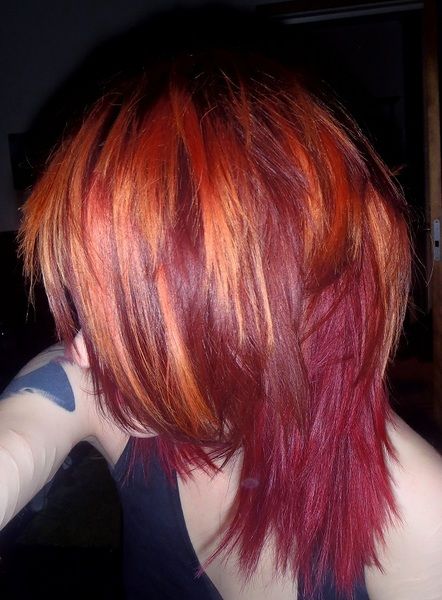 Red/orange hair. Color not cut Red And Orange Streaks Hair, Orange Hair With Red Highlights, Orange Roots Red Hair, Fire Dyed Hair, Orange And Red Hair Color, Orange To Red Hair, Red Hair Orange Highlights, Dark Red And Orange Hair, Red And Orange Hair Color