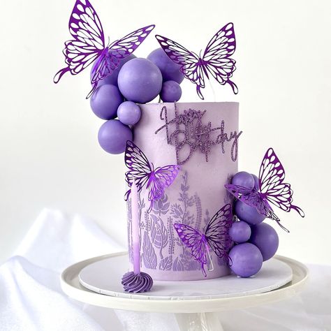 🦋 Dive into the enchantment of this gorgeous purple cake, a masterpiece by @cakegarden.au! 🍰✨ Adorned with delicate purple butterflies, each detail is a stroke of elegance. Adding a touch of whimsy, a single Lilac Cake Candle from us and the Happy Birthday acrylic topper from @_miniandco_ graces the scene. Sometimes, it just takes a few elements to create pure magic. 💫 #purplecake #purplecakes #purplecake💜 #birthdaycake🎂 #birthdaycakeideas #birthdaycakes #birthdaycandle #birthdaycandles #... Purple First Birthday Cake, Lilac Birthday Cake, Holidays Snacks, 18th Birthday Cake Designs, Lilac Cake, Purple Birthday Cake, Purple Butterfly Cake, Cake Purple, 15th Birthday Party Ideas