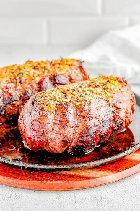 Easy Beef Tenderloin Roast with Garlic Herb Butter — An EASY yet IMPRESSIVE dish that’s ready in under an hour! Roasting beef tenderloin in the oven results in perfectly MOIST and TENDER meat every time, and the garlic herb butter adds tons of flavor without overwhelming the beef. If cooking beef tenderloin intimidates you, follow this straightforward recipe! Beef Tenderloin In The Oven, Easy Beef Tenderloin, Tenderloin In The Oven, Oven Roast Beef, Cooking Beef Tenderloin, Cooking Beef, Beef Tenderloin Roast, Tenderloin Roast, Cooking The Perfect Steak