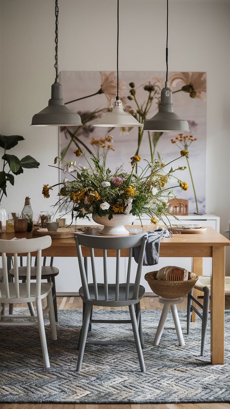 Elevate your dining experience with this delightful setup featuring a centerpiece of wildflowers that brings life to the table! Styled with the sleek NORDEN extendable table and comfortable INGOLF chairs, this space is perfect for both intimate dinners and lively gatherings. The STOCKHOLM rug adds a touch of personality while pendant lighting beautifully highlights your table setting. Embrace elegance and cheerfulness in your home! Discover more tips on creating a stunning dining area. #DiningInspiration #IKEAStyle #HomeDecor #WildflowerCenterpiece #ElegantDining Ingolf Ikea, Hygge Dining Room, Stockholm Ikea, Stockholm Rug, Ikea Norden, Ikea Style, Wildflower Centerpieces, Dining Inspiration, Extendable Table