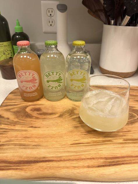 Betty Buzz Sarah Vazquez Betty Buzz Recipes, Buzz Button Drinks, Betty Buzz Mocktail Recipe, Buzz Without Alcohol, Buzzballz Drink Recipes, Snowglobe Drink Rosemary, Betty Buzz, Sparkling Margarita, New Drink