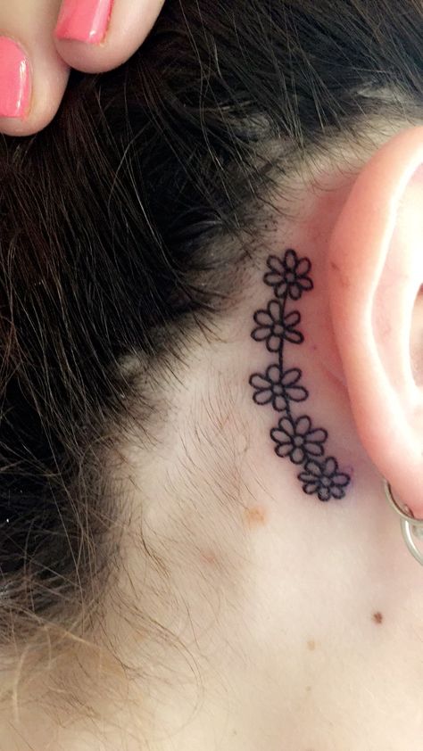 Daisy chain tattoo behind the ear Daisy Tattoo Behind Ear, Flower Chain Tattoo, Daisy Chain Tattoo, Small Daisy Tattoo, Sunflower Tattoo Simple, Sunflower Tattoo Thigh, Chain Tattoo, Sunflower Tattoo Shoulder, Sunflower Tattoo Sleeve